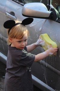 Bella washing a car