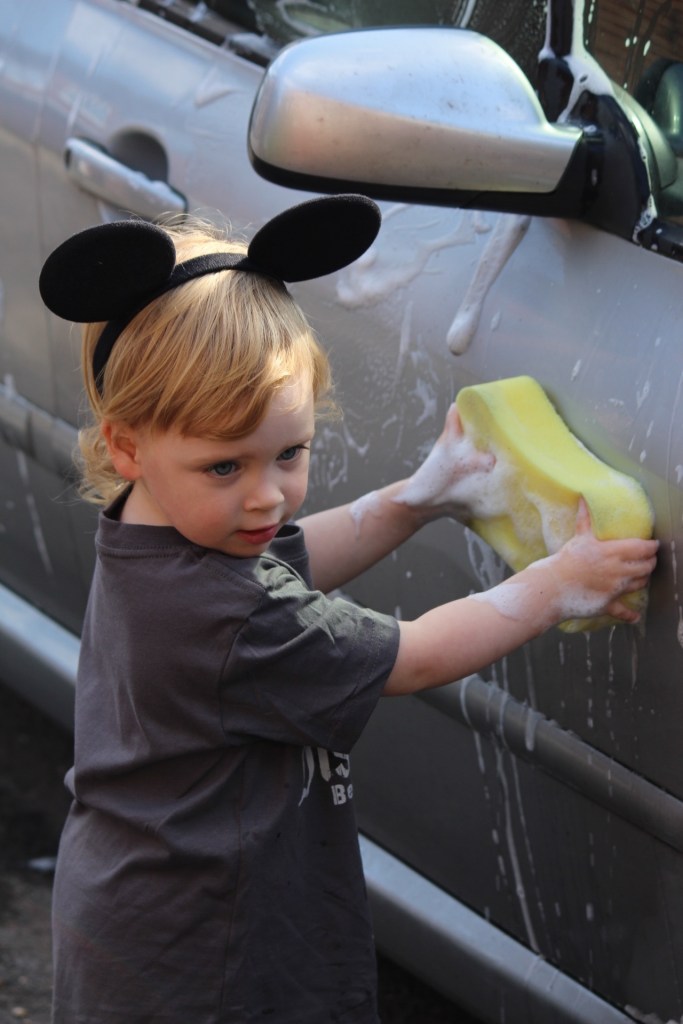 Bella washing a car