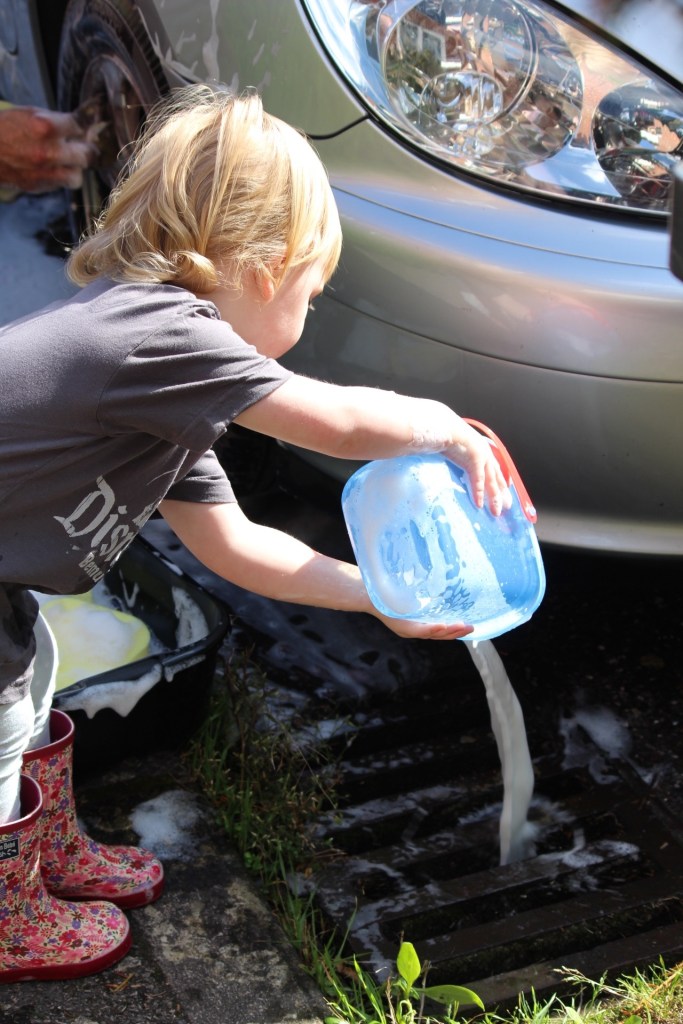 Bella washing a car