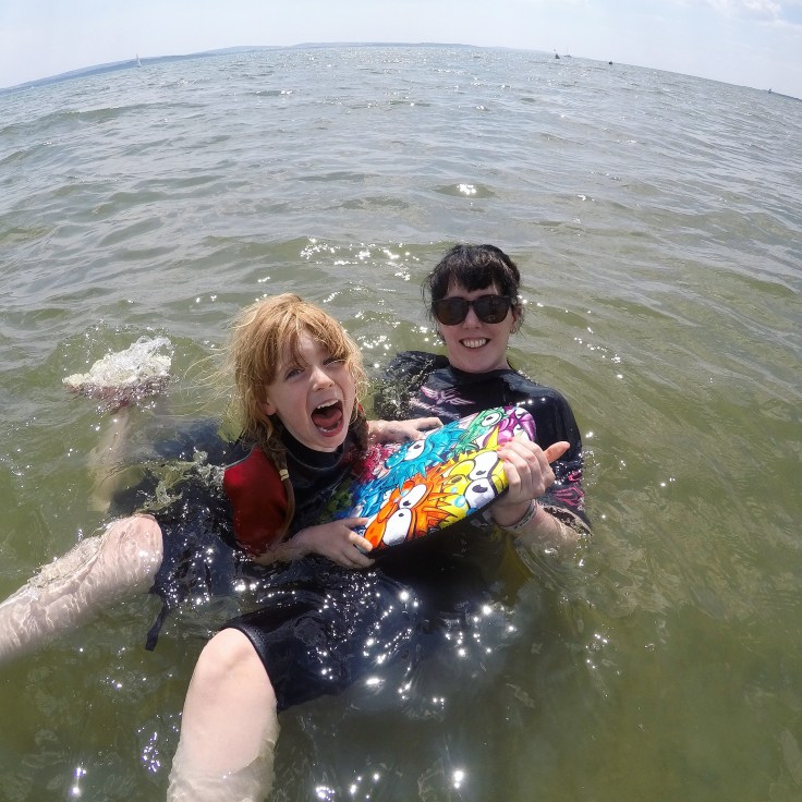 Leaping into the sea at Lepe Beach